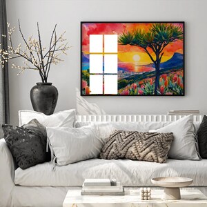 Cape Town sunset, showcasing Table Mountain, protea flowers, and a vibrant sky in warm tones.