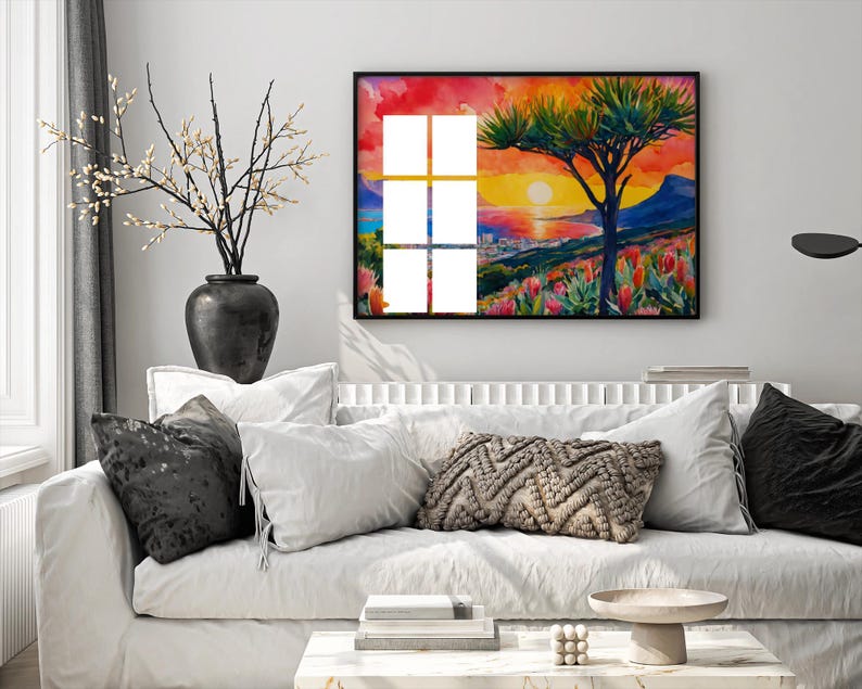 Cape Town sunset, showcasing Table Mountain, protea flowers, and a vibrant sky in warm tones.