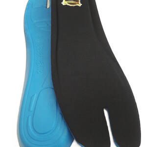 May include: Two insoles, one blue and one black, designed for split-toe footwear. The blue insole has a contoured design with text. The black insole has a split toe design and a gold and brown label.
