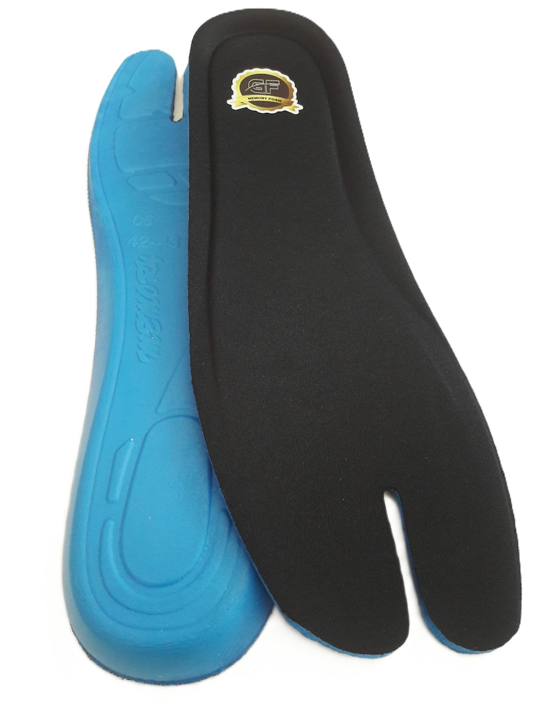 May include: Two insoles, one blue and one black, designed for split-toe footwear. The blue insole has a contoured design with text. The black insole has a split toe design and a gold and brown label.