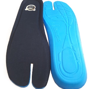 May include: Two insoles, one navy blue and one bright blue. The navy blue insole has a split toe design and a small logo. The bright blue insole has a contoured design with the size 42-43 printed on it. The insoles are designed for comfort.