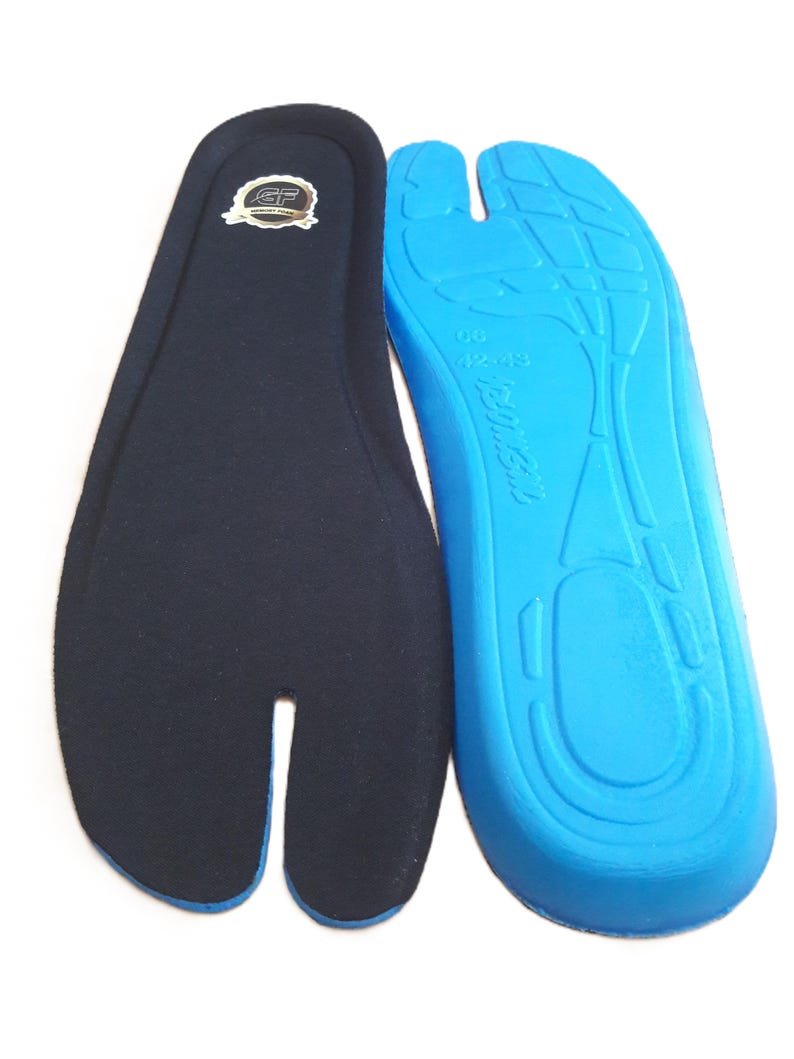 May include: Two insoles, one navy blue and one bright blue. The navy blue insole has a split toe design and a small logo. The bright blue insole has a contoured design with the size 42-43 printed on it. The insoles are designed for comfort.