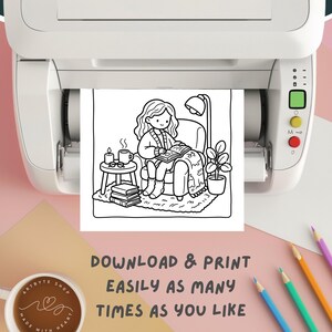May include: Black and white line art print of a person reading in a cozy setting, printed from a printer. The image includes a chair, side table with a cup and candles, and the text "DOWNLOAD & PRINT EASILY AS MANY TIMES AS YOU LIKE."