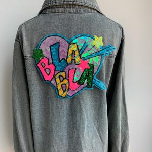 Sequined Heart Iron On Patch: Purple Glitter "Bla Bla" Appliqué