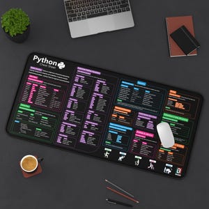 May include: A black desk mat featuring a comprehensive Python cheat sheet with white, pink, blue, and orange text and diagrams. The mat displays sections on data types, control flow, functions, operators, and data structures for programming reference.