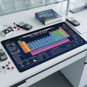 May include: A dark blue desk mat featuring a printed periodic table of elements with colorful chemical groups, atomic numbers, and symbols. The mat includes detailed scientific reference charts, legends, and key information sections printed in white text.
