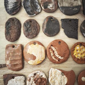 Set of 20 handmade ceramic pendants