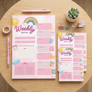 May include: Pink weekly planner with a rainbow and sun graphic. Includes sections for each day of the week, a to-do list, and note sections. Also includes a pink pen, washi tape, and a small succulent.