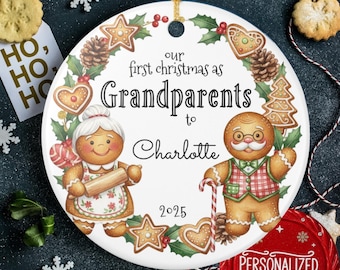 May include: A white ceramic Christmas ornament with a gold string. The ornament features gingerbread grandparents and the text "our first christmas as Grandparents to Charlotte 2025". Decorated with gingerbread cookies and holly.