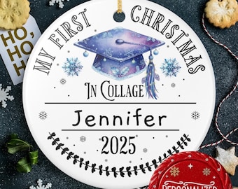 May include: White ceramic Christmas ornament with the text "MY FIRST CHRISTMAS IN COLLEGE" and the name "Jennifer" with the year "2025". The ornament features a graduation cap design with snowflakes and a tassel.