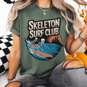Comfort Colors® Skeleton Surf Club Shirt – Funny Halloween Beach Tee with Spooky Skeletons Surfing, Coastal Goth Shirt