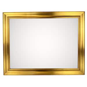Puede incluir: Un espejo rectangular con un marco dorado. El marco tiene un diseño detallado y texturizado. La superficie reflectante del espejo es clara y la estética general es clásica y elegante. El espejo es adecuado para la decoración del hogar.