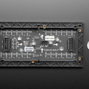 Pode incluir: Uma placa de circuito preta com uma moldura de pl&aacute;stico preta, com v&aacute;rios componentes eletr&ocirc;nicos, conectores e o texto "S211603 H00424". Uma moeda &eacute; colocada ao lado para compara&ccedil;&atilde;o de tamanho.