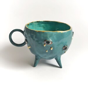 Turquoise and gold ceramic mug