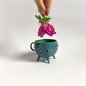 Turquoise and gold ceramic mug