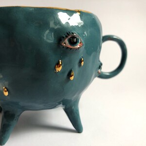 Turquoise and gold ceramic mug, Handmade ceramic tea cup with legs, Ceramic eye tears motif, Eclectic decorative mug, Artistic coffee mug