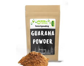 May include: A brown paper bag of guarana powder with the text "GUARANA POWDER" in white letters on a black background. The bag also has the text "forestgoodsbg" and "Premium Grade". A small pile of brown powder sits in front of the bag.