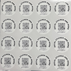 May include: Twelve white round stickers with black text and a black and white QR code. The text reads "Decal Sticker and More" and "Thanks for your support!"