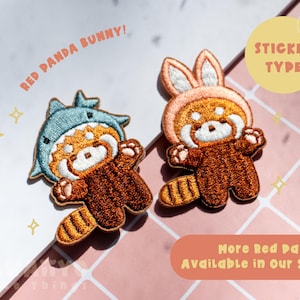 May include: Two embroidered patches of red pandas. One wears a shark hat, the other a bunny hat. The text "RED PANDA BUNNY!" is above the shark hat panda. "STICKER TYPE" is in a yellow circle. "More Red Pandas Available in Our Shop!" is in a brown rectangle.