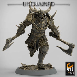 May include: A miniature figurine of a warrior in gold and black armour, holding two axes. The warrior has horns and a helmet with a skull design. The figurine is standing on a base with skulls.