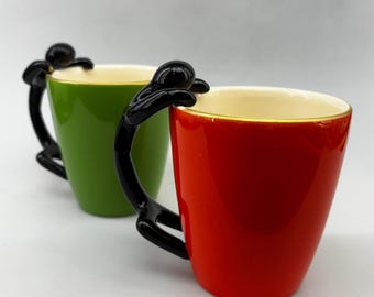 Whimsical Red and Green Pottery Cups with figurine handle, Set of 2