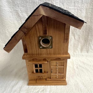 Hand made natural looking birdhouse designed to last.
