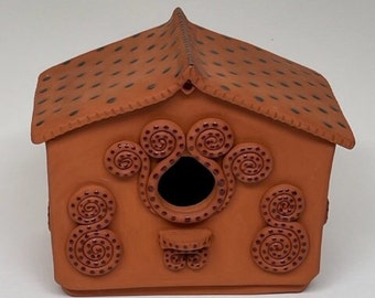 Handmade ceramic birdhouse for outdoor use