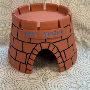 Handmade, outdoor ceramic toad Castle