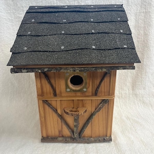 Hand made natural looking birdhouse designed to last.