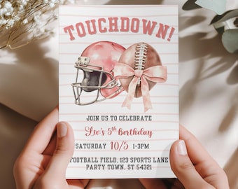 May include: A football-themed birthday invitation in pink and white. The design includes a football helmet and ball with a bow, and the text "TOUCHDOWN!" The invitation also includes the party details: Liv's 5th Birthday, Saturday 10/5, 1-3PM.
