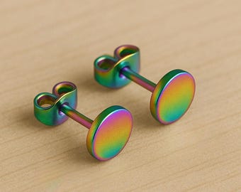 May include: A pair of iridescent rainbow stud earrings. The earrings are made of metal and have a round shape.