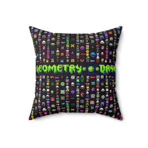 May include: A black pillow with a colorful pixelated design featuring the text "GEOMETRY DASH". The design includes various geometric shapes and characters.