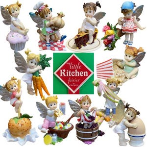 May include: A collection of My Little Kitchen Fairies figurines by Enesco, featuring small winged characters interacting with various food items like cupcakes, garlic, pie, popcorn, carrots, oranges, cheese, grapes, and eggs, with a central logo.