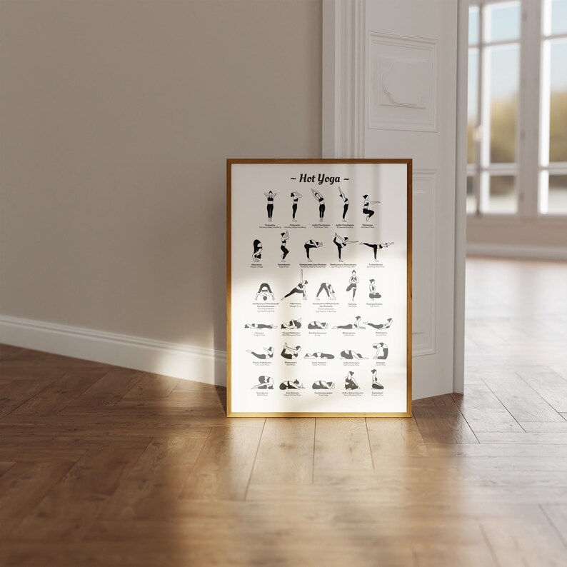 May include: A black and white poster with the title "Hot Yoga" and illustrations of different yoga poses. The poster is framed in a gold frame and is hanging on a white wall.