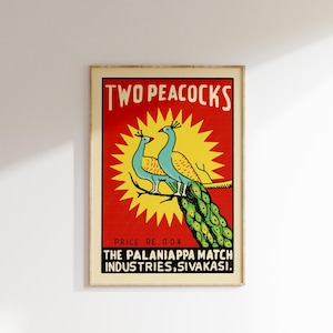 May include: Vintage matchbox label featuring two peacocks with a yellow sun and red background. The text reads "TWO PEACOCKS" and "THE PALANIAPPA MATCH INDUSTRIES, SIVAKASI."