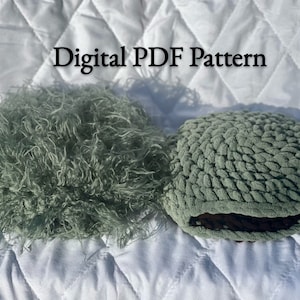 May include: Two green fabric round cushions, one with a fluffy texture and the other with a woven texture. The text "Digital PDF Pattern" is written in black above the cushions.