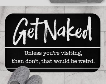 Puede incluir: Alfombra de baño negra y blanca con el texto "Get Naked" en una fuente blanca de pinceladas. Debajo del texto hay una línea blanca y el texto "Unless you're visiting, then don't, that would be weird."