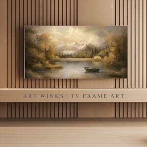 May include: A framed landscape painting of a lake with mountains in the background. The lake is surrounded by trees and there is a small boat in the water. The painting is in a brown frame and is hanging on a wall with wood paneling.