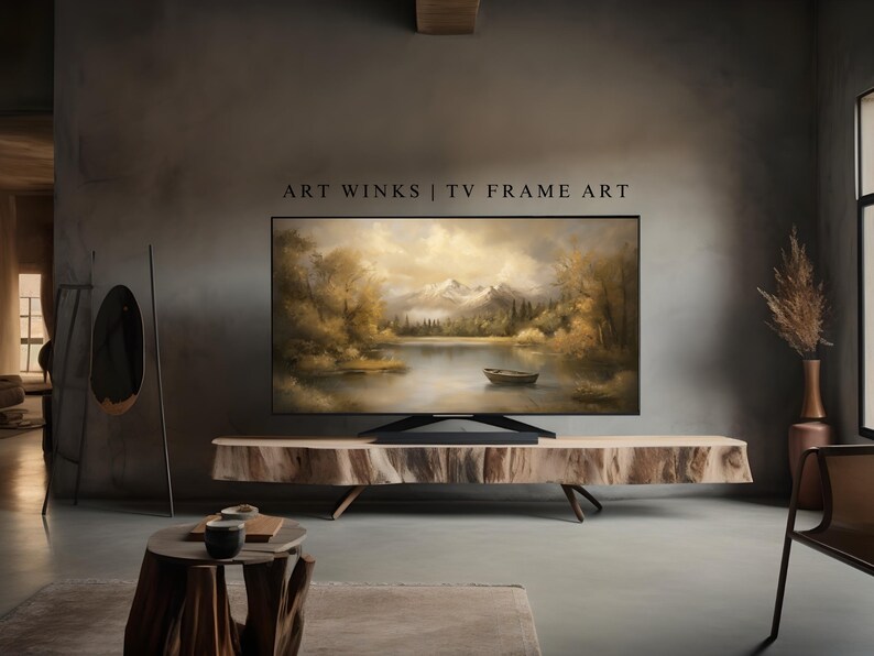 May include: A modern living room with a large flat screen TV displaying a landscape painting of a lake and mountains. The TV is mounted on a wooden stand. The room is decorated in a minimalist style with a gray wall and a wooden floor.