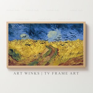Puede incluir: Una impresión enmarcada de una pintura de paisaje al estilo de Van Gogh. La obra presenta un campo de trigo amarillo bajo un cielo azul oscuro con nubes arremolinadas y pájaros volando. El marco es de color marrón claro, y el texto "ART WINKS | TV FRAME ART" está en la parte inferior.