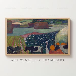May include: A framed landscape painting with a pastoral scene. The artwork features cows, figures, and haystacks in a field. The color palette includes greens, blues, and oranges. The text "ART WINKS | TV FRAME ART" is at the bottom.