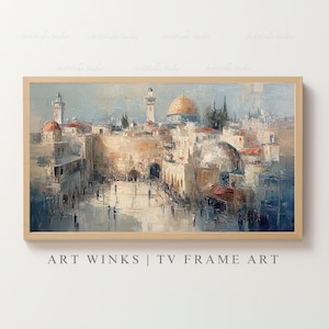 May include: An oil painting depicting a cityscape with a golden dome and multiple towers, presented within a light wood frame. The text "ART WINKS | TV FRAME ART" is printed at the bottom of the frame.