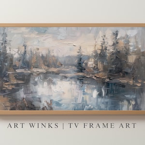 May include: A framed painting of a misty forest scene with a lake in the foreground. The painting is done in shades of blue, gray, and brown, with a soft, impressionistic style.