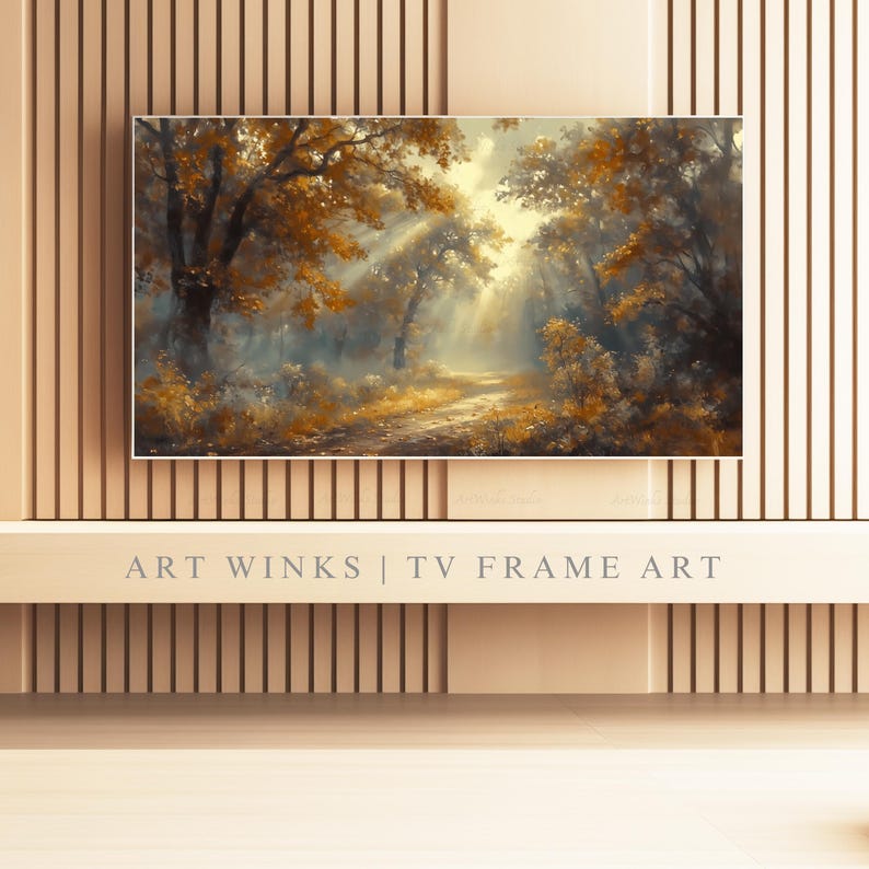 May include: A framed landscape painting of a forest scene with a path. The artwork features warm tones of gold, brown, and yellow, with sunlight streaming through the trees. The text "ART WINKS | TV FRAME ART" is at the bottom.