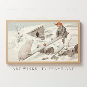 May include: A framed vintage print depicts a whimsical winter scene. A pig and a gnome are on a seesaw with an apple. A small wooden structure is in the background. The artwork is in a light wood frame.