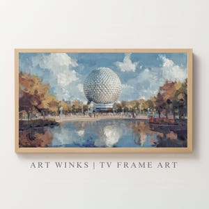 May include: A framed art print of a landscape painting featuring a large geodesic sphere, trees, and a body of water. The sky is blue with white clouds. The text "ART WINKS | TV FRAME ART" is at the bottom.