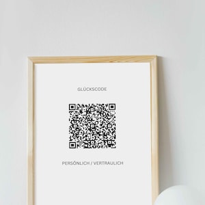 May include: A framed print with a black and white QR code and the text "GLÜCKSCODE" and "PERSÖNLICH / VERTRAULICH" in a white frame.