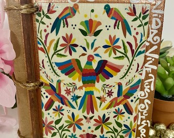 May include: A small wooden box with a colorful Mexican folk art design featuring birds and flowers. The box is decorated with the text "Yo Quiero Vivir Soñando".