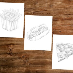 May include: Three black and white pencil drawings of different fast food items. The first drawing is of a container of french fries. The second drawing is of a hot dog with toppings. The third drawing is of a slice of pizza.