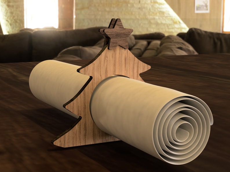 May include: Wooden Christmas tree napkin ring with a star on top. The ring is holding a rolled up white napkin.